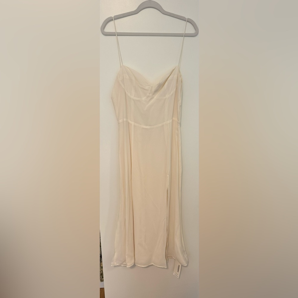 Reformation ivory dress with cup detail and high slit
